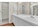 Bathroom features double sink vanity with white cabinets and walk-in closet at 1054 Weathervane Hill Dr, Rocky Mount, NC 27803