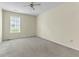 Neutral bedroom with carpeted floors and a window offering natural light at 1054 Weathervane Hill Dr, Rocky Mount, NC 27803