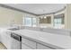 Eat-in kitchen featuring modern white counters, stainless appliances, and natural light at 1054 Weathervane Hill Dr, Rocky Mount, NC 27803