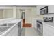Galley kitchen featuring white counters and cabinets, plus stainless appliances at 1054 Weathervane Hill Dr, Rocky Mount, NC 27803