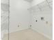Laundry room with wire shelving and hookups for washer and dryer at 1054 Weathervane Hill Dr, Rocky Mount, NC 27803
