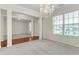 Open-concept living space with natural light, chandelier and easy flow into other areas at 1054 Weathervane Hill Dr, Rocky Mount, NC 27803