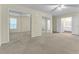 Spacious main bedroom featuring mirrored closet doors and a ceiling fan at 1054 Weathervane Hill Dr, Rocky Mount, NC 27803