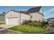 Backyard with a garage, fencing, grass, shrubs, and partial view of neighborhood at 109 Broadwater Dr, Wake Forest, NC 27587