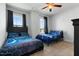 Bright bedroom with large windows, comfortable beds, and a ceiling fan with light at 109 Broadwater Dr, Wake Forest, NC 27587