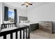 Bedroom with a crib, dresser, bed, and curtains at 109 Broadwater Dr, Wake Forest, NC 27587