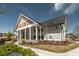 Stylish clubhouse with a modern exterior, covered porch, professional landscaping, and ample parking at 109 Broadwater Dr, Wake Forest, NC 27587