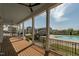 Large covered deck offering views of the community pool and common areas, with ceiling fans and wood floors at 109 Broadwater Dr, Wake Forest, NC 27587