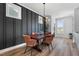 Elegant dining room boasting modern light fixture, wood table, and stylish chairs near a window at 109 Broadwater Dr, Wake Forest, NC 27587