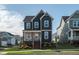 Charming two-story home featuring a cozy front porch and modern exterior paint at 109 Broadwater Dr, Wake Forest, NC 27587