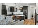 Bright kitchen featuring stainless steel appliances, a gas range, and stylish pendant lighting at 109 Broadwater Dr, Wake Forest, NC 27587