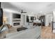 Open-concept living room and kitchen with modern finishes, a fireplace, and comfortable seating at 109 Broadwater Dr, Wake Forest, NC 27587