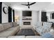 Modern living room with a fireplace, neutral colors, and comfortable furniture, great for relaxing and entertaining at 109 Broadwater Dr, Wake Forest, NC 27587