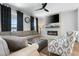 Cozy living room featuring a modern fireplace, a comfortable sofa, and stylish decor details at 109 Broadwater Dr, Wake Forest, NC 27587
