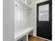 Entryway featuring built-in bench and storage, next to a black door at 109 Broadwater Dr, Wake Forest, NC 27587