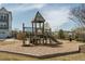 Community playground area with play structure, slides, and wood chip ground cover, close to neighborhood homes at 109 Broadwater Dr, Wake Forest, NC 27587