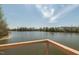 Peaceful pond view from an elevated deck with railing; mature trees lining the opposite shore at 109 Broadwater Dr, Wake Forest, NC 27587