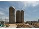 Community landmark featuring three silos with walkways and landscaping in a walkable neighborhood at 109 Broadwater Dr, Wake Forest, NC 27587