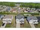 Aerial view of the home highlighting its position, landscaping, neighborhood, and surrounding trees at 109 Oak Rise Ln, Fuquay Varina, NC 27526