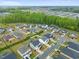 Neighborhood aerial view displaying many houses with verdant trees surrounding the attractive community at 109 Oak Rise Ln, Fuquay Varina, NC 27526