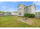Spacious backyard with a fire pit area, chairs, and well-maintained lawn perfect for outdoor enjoyment at 109 Oak Rise Ln, Fuquay Varina, NC 27526