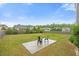 A lush backyard boasts a cozy fire pit area with seating, perfect for outdoor gatherings and relaxation at 109 Oak Rise Ln, Fuquay Varina, NC 27526