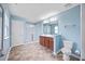 En suite bathroom featuring double vanity, tiled floors, and glass shower at 109 Oak Rise Ln, Fuquay Varina, NC 27526