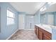 Bright bathroom featuring double vanity, tiled floors, and glass shower at 109 Oak Rise Ln, Fuquay Varina, NC 27526