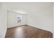 Bedroom featuring a window for natural light and wood floors at 109 Oak Rise Ln, Fuquay Varina, NC 27526