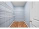 Walk-in closet with wooden floors and wire shelving at 109 Oak Rise Ln, Fuquay Varina, NC 27526