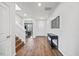 Inviting entryway featuring wood floors, stairs, a console table, and stylish decor leading into the home at 109 Oak Rise Ln, Fuquay Varina, NC 27526