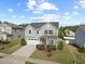 Two-story home featuring a two-car garage and landscaped yard; it's a beautiful house with well kept lawn at 109 Oak Rise Ln, Fuquay Varina, NC 27526