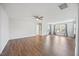 Open living space with hardwood floors, ceiling fan, and bright natural light at 109 Oak Rise Ln, Fuquay Varina, NC 27526