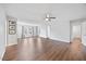 Spacious and bright living area featuring modern flooring, fan and ample natural light at 109 Oak Rise Ln, Fuquay Varina, NC 27526
