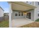 Cozy covered patio with neutral siding, recessed lighting, and sliding glass doors to the home's interior at 109 Oak Rise Ln, Fuquay Varina, NC 27526