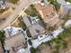 Aerial view of home showcases snow-dusted roof, well-kept lawn, private backyard with an outdoor deck, and mature trees at 109 Yorkchester Way, Raleigh, NC 27615