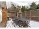 Outdoor deck with dining set, an umbrella, and a decorative privacy lattice at 109 Yorkchester Way, Raleigh, NC 27615