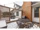 Outdoor patio featuring a wooden deck, brick chimney, grill, table, and seating perfect for backyard gatherings at 109 Yorkchester Way, Raleigh, NC 27615