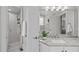 Well-lit bathroom with granite countertops, shower, and mirrored cabinets at 109 Yorkchester Way, Raleigh, NC 27615