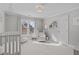 Cozy Bedroom with crib, white rocking chair, and soft neutral tones at 109 Yorkchester Way, Raleigh, NC 27615