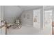 Bonus room with angled ceilings, a seating area, and access to other rooms at 109 Yorkchester Way, Raleigh, NC 27615
