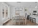 Charming dining room with modern chandelier and adjacent gourmet kitchen at 109 Yorkchester Way, Raleigh, NC 27615
