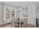 Bright dining room with stylish chandelier, a table for six, and built-in cabinets at 109 Yorkchester Way, Raleigh, NC 27615
