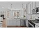 Modern kitchen with granite countertops and stainless steel appliances at 109 Yorkchester Way, Raleigh, NC 27615
