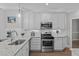 Kitchen with granite countertops, stainless steel appliances, and white subway tile backsplash at 109 Yorkchester Way, Raleigh, NC 27615