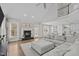 Spacious living room featuring fireplace, hardwood floors, and plush sectional at 109 Yorkchester Way, Raleigh, NC 27615