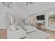 Expansive living room with a modern sectional, fireplace and mounted TV at 109 Yorkchester Way, Raleigh, NC 27615