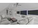 Upstairs living room has large, mounted televisions and a comfortable gray couch at 109 Yorkchester Way, Raleigh, NC 27615