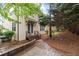 Backyard view from house to patio, with trees, and lawn at 1104 Hobson Ct, Raleigh, NC 27607