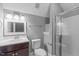 Bathroom featuring a vanity with dark wood cabinets and a walk-in shower at 1104 Hobson Ct, Raleigh, NC 27607